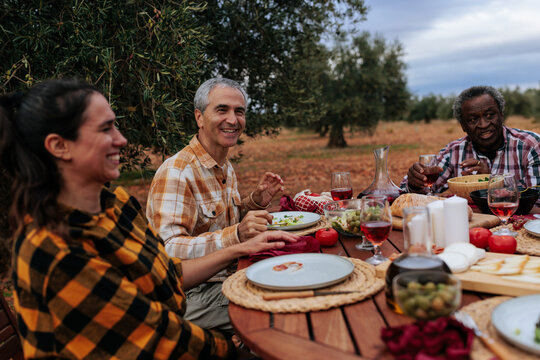 Farmers enjoying lunch together in olive grove