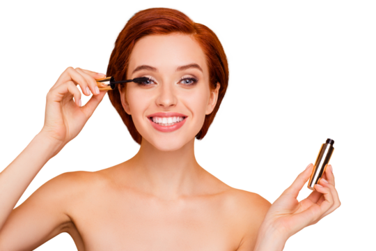 Close-up portrait of nice lovely cute sweet attractive glamorous well-groomed cheerful positive girl holding in hands applying trendy black mascara isolated over beige pastel background