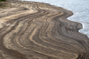 Low level Reservoir reveals Pattern on beach