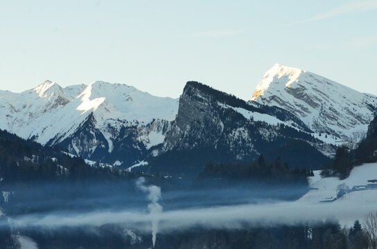 Snow-Capped Mountains and Misty Valleys