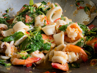 Stir-fried spicy seafood with basil (Stir-fried seafood with basil) A popular Thai dish that is typical of popular Thai street food. The concept of Thai food, original recipes