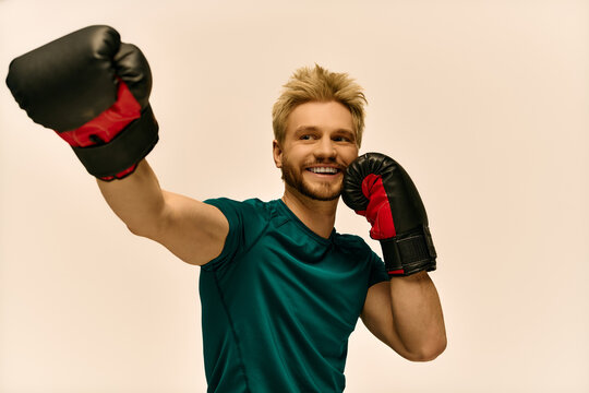 Young man celebrates a boxing victory while showcasing his skills in an energetic arena