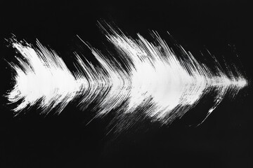 Abstract white brushstrokes on black background forming an arrow shape