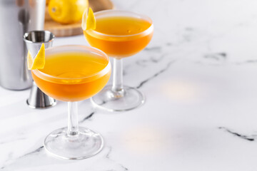 Paper plane cocktail on white marble background. Copy space