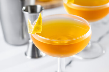 Paper plane cocktail on white marble background