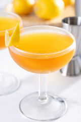 Paper plane cocktail on white marble background