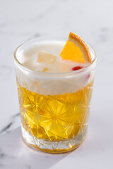 Classic cocktail whiskey sour on white marble background