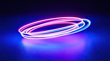 Naklejka premium Neon light rings of pink and blue on a dark background.