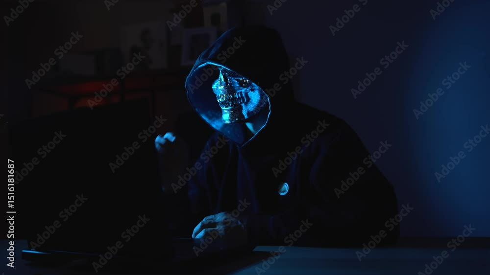 Poster hacker in hoodie and face mask hiding in shadows while typing – symbol of blackmarket intrusion, cyb