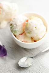 Milk yogurt and jelly ice cream in a white bowl.