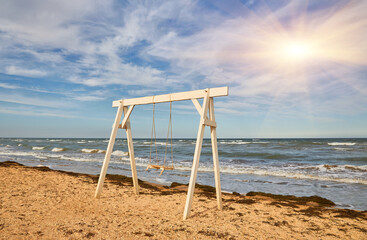 Wooden Swing on the Beach