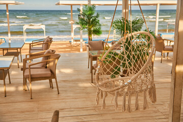 Beachfront Cafe Terrace with Hanging Chair