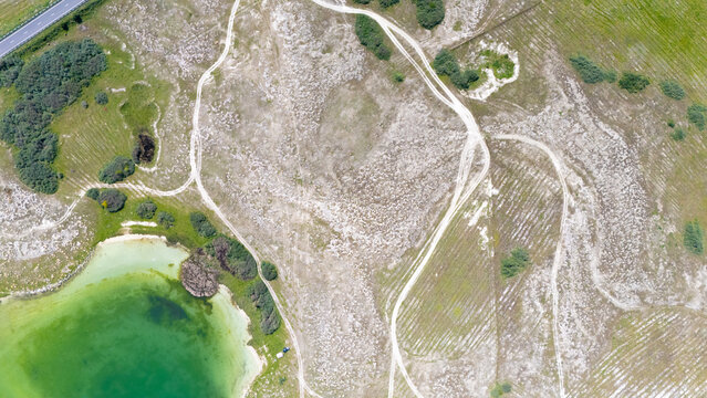 Aerial view of a tropical island with white sand beaches and volcanic features, captured by drone. Chayeri Island, Sevan, Armenia