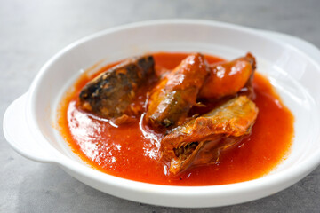 Mackerel in Tomato Sauce,canned fish,Tinned fish in a white plate	