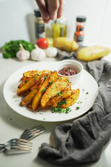 Tasty of baked potatoes with paprika and garlic, topped with fresh parsley and rich tomato sauce an irresistible homemade dish served fresh from the oven.
