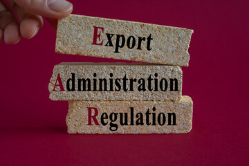 EAR text on brick blocks - acronym short for Export Administration Regulation. Beautiful red...
