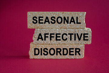 Sad - Seasonal Affective Disorder symbol. Brick blocks with words Sad-Seasonal Affective Disorder....