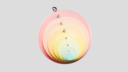 Pastel colored concentric circles with metal spheres creating a spiral pattern on gray background