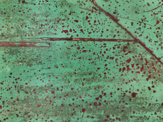 Close up of weathered and rusty green surface. Old green wall grunge and dirt texture decayed by...