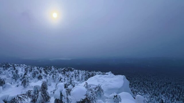 View of the white rocks and the winter forest on Mount Polyud. Lappish spruces on Mount Polyud in the Perm region in winter. In winter, there is a lot of snow and frost on the trees in the Urals. 4К	