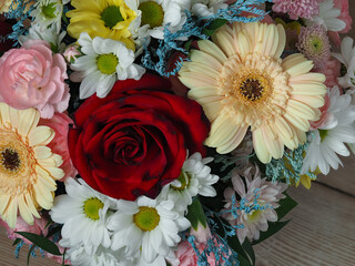 colorful different types of flowers in a bouquet, daisy, carnation, dahlia, rose, gypsophila,...
