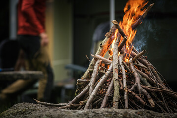 Campfire Burns Brightly at Outdoor Gathering During Evening Campout in the Wilderness