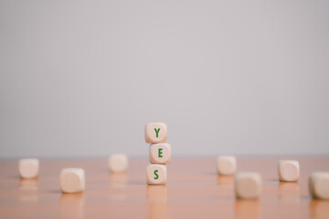 Wooden blocks show right and wrong signs, ideas, decisions, votes and yes or no. Business options...