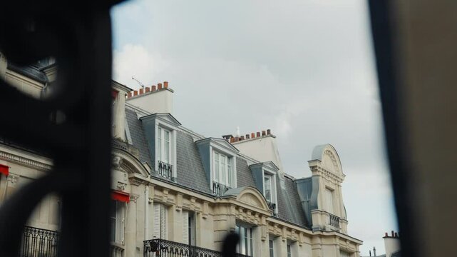 Ornate gate reveals parisian building