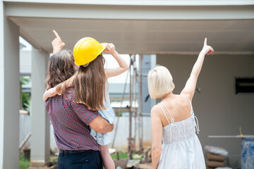 Real Estate Family Excited About New Home Construction, Visiting Site and Planning Their Future...