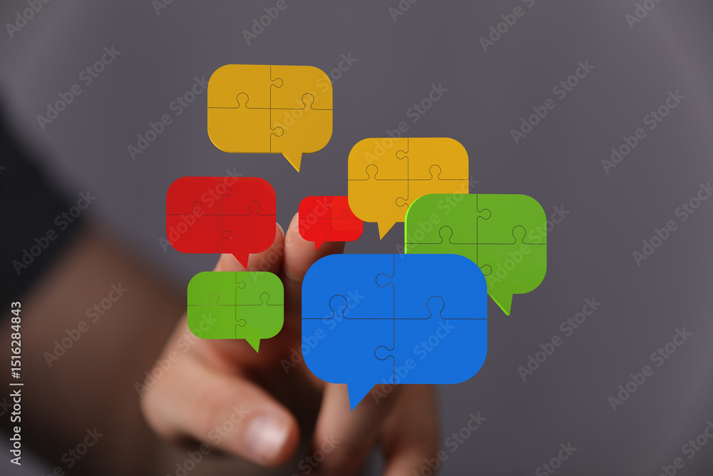 Poster abstract image of puzzle pieces forming speech bubbles, representing communication and teamwork.