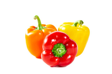 Fresh juicy shiny red, yellow and orange bell peppers. Isolated on white.