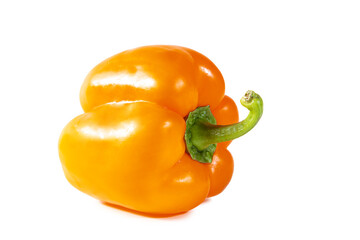 Fresh juicy shiny orange bell pepper isolated on white background.