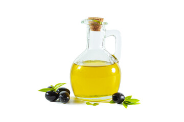 Extra virgin olive oil in a transparent jug and black olives with leaves.