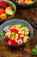 Plate of shrimp fruits salad.