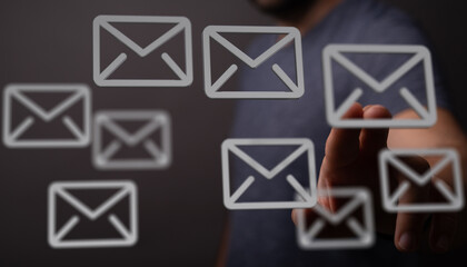 Person interacting with email icons, digital communication, inbox management.