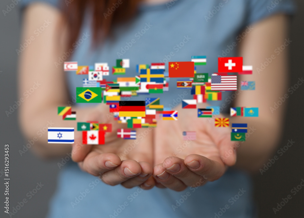 Poster image of hands holding a diverse array of flags, symbolizing global unity and international collabor