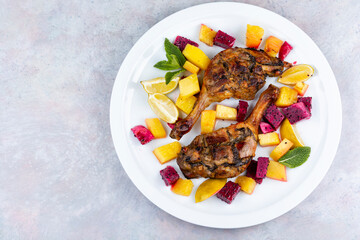 Portion of roast duck leg.