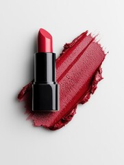 Close-up of a red lipstick with a black cap. the lipstick is placed on a white background and there is a swatch of the lipstick on the right side of the image.