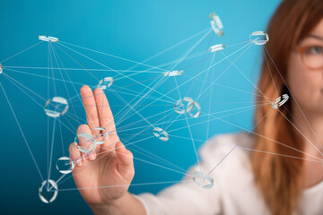 Abstract image of a woman interacting with a digital network, showcasing connection and technology.