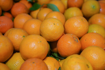 Close up fresh orange from fresh market. Orange background.