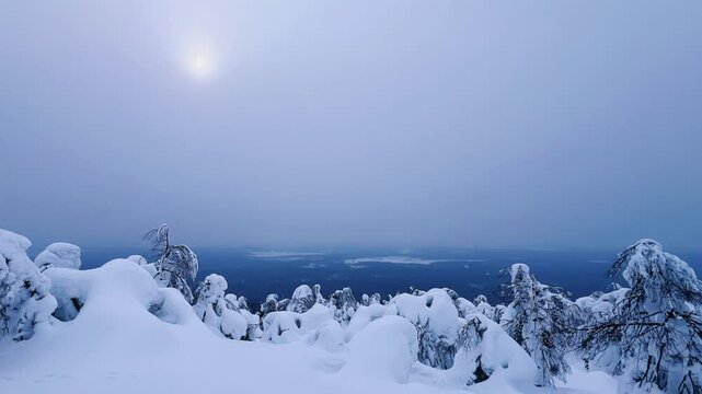 View of the white rocks and the winter forest on Mount Polyud. Lappish spruces on Mount Polyud in the Perm region in winter. In winter, there is a lot of snow and frost on the trees in the Urals. 4К	