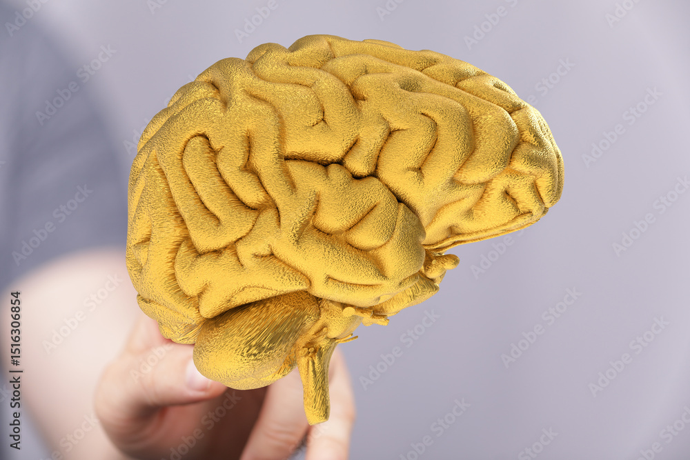 Poster high-quality stock photo of a golden brain. ideal for concepts of intelligence, innovation, and thin