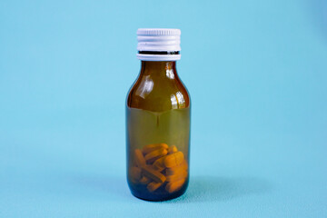 brown glass bottle for supplement product isolated on white background with clipping path