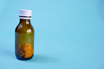 brown glass bottle for supplement product isolated on white background with clipping path