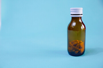 brown glass bottle for supplement product isolated on white background with clipping path