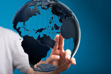 Abstract image of a hand interacting with a 3D model of the Earth, representing global connectivity...