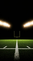 Naklejka premium Looking down empty sports field at night with bright stadium lights