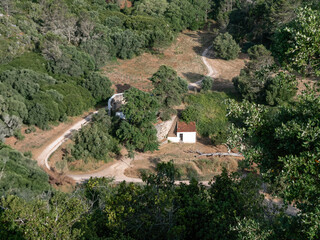Restored outbuildings and water cistern at urban farm in Portugal