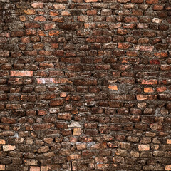 Seamless dark grunge brick wall texture showing deterioration