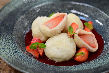 Traditional summer dish – cottage cheese dumplings with fresh strawberries. A beloved homemade dessert from Central Europe
